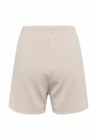 Světlé béžové šortky s elastickým pasem, vyrobené z měkkého materiálu. Mají jednoduchý, čistý design bez viditelných zdobení.