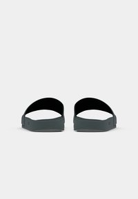 Dark gray slide sandals with a wide opening, made of soft material. Features a flat sole and a textured footbed for grip.