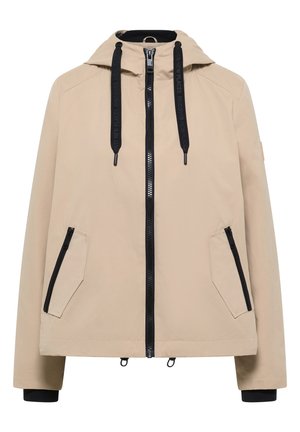 Veste à capuche beige avec une fermeture éclair noire, deux poches avant zippées, cordons noirs avec texte, et poignets intérieurs noirs.