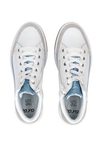 White leather sneakers with light blue accents, featuring round laces, padded tongue, and soft textured insole. Subtle design elements.