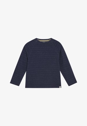 Granatowy sweter z długim rękawem, z subtelnym poziomym białym wzorem w kropeczki i okrągłym dekoltem, mała metka marki na dolnym brzegu.