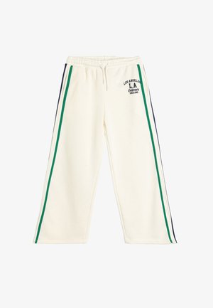 Crème-kleurige joggingbroek met groene en marineblauwe zijstrepen, elastische tailleband en tekstdetail "Los Angeles L.A. California Since 1990".