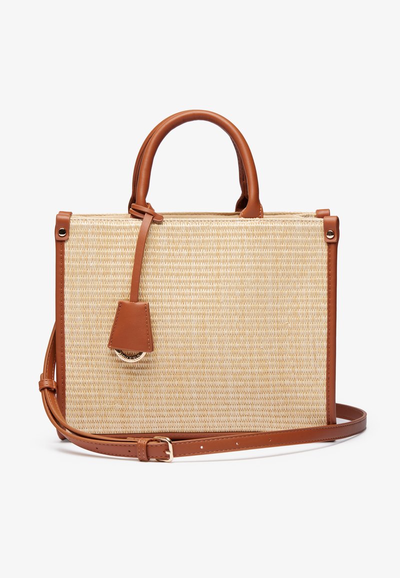 Woven straw handbag with brown leather accents, rectangular shape, structured design, top handles, and a detachable shoulder strap.