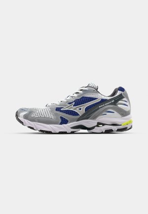 Sport shoe with a gray mesh upper, blue accents, and a cushioned white sole. Features laces, logo detail, and textured overlays.