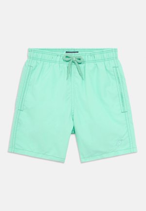 Világoszöld fürdőnadrág rugalmas derékpánttal, elöl húzózsinórral, oldalzsebekkel és egy diszkrét teknős logóval az alsó jobb oldalon.