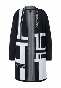 Svart och vit cardigan med abstrakta geometriska mönster, öppen fram, två fickor och texturerad tyg. Texten säger "MODERN" och "VIEW."