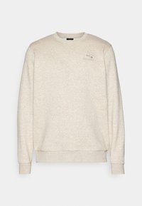 Ljusbeige crewneck sweatshirt med långa ärmar och liten Under Armour-logga på vänster bröst.