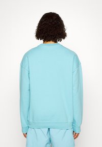 Levi's® Gold Tab CREW - Športni pulover - milky blue