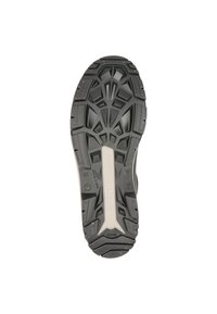 Semelle de chaussure en caoutchouc noir avec un profil texturé présentant des motifs géométriques, une plaque centrale blanche avec un logo, et des grips surélevés pour la traction.