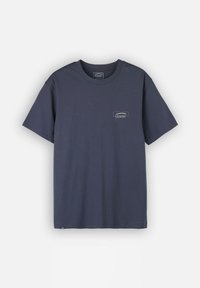 T-shirt bleu marine en coton, avec un col rond et un petit logo brodé sur la poitrine gauche. Manches courtes, coupe décontractée.