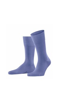 Calzini di cotone lilla chiaro con polsino a costine, texture liscia e dettaglio del logo sulla punta. Progettati per comfort e vestibilità.