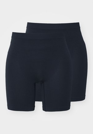 Boxers ribbed bleu marine foncé avec une ceinture élastique, de longueur mi-cuisse et sans coutures. Deux paires exposées.