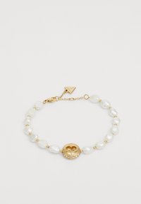 Geselecteerd, yellow gold-coloured