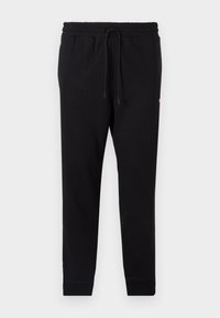 Black sweatpants made of soft fabric, featuring an elastic waistband with drawstring, tapered legs, and ribbed cuffs.
