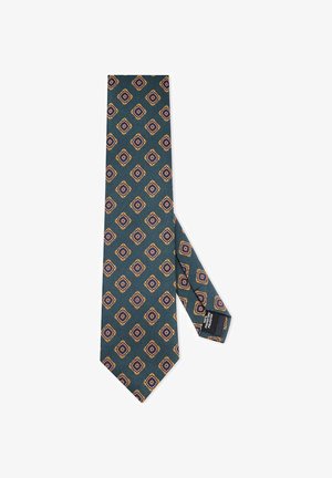 Krawat w wzory z zielonym tłem oraz diamentowymi kształtami w kolorze fioletowym i złotym. Gładka tekstura i klasyczny, wąski fason.