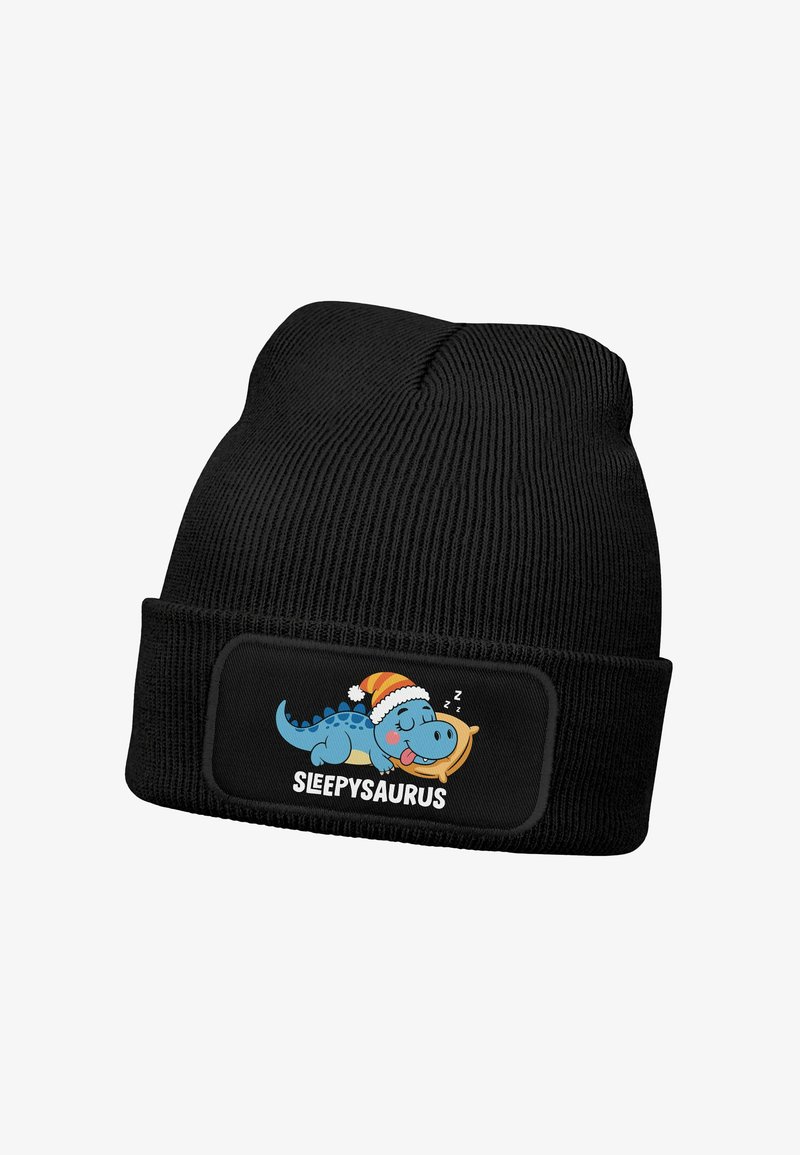 Black knit beanie featuring a rectangular patch with a cartoon blue dinosaur wearing a Santa hat, and the text “SLEEPSAURUS.”