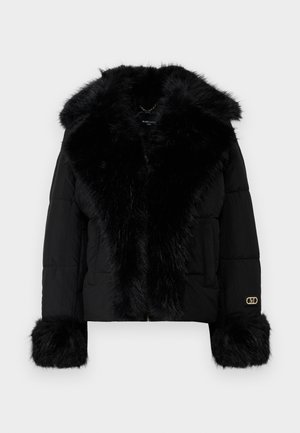 Black puffer jacket with a faux fur collar and cuffs, featuring a gold logo accent and a front zipper closure. Smooth texture and cropped design.