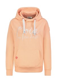 Perzikkleurige hoodie gemaakt van zacht stof, met een voorzak, witte trekkoorden en decoratieve tekst aan de voorkant.