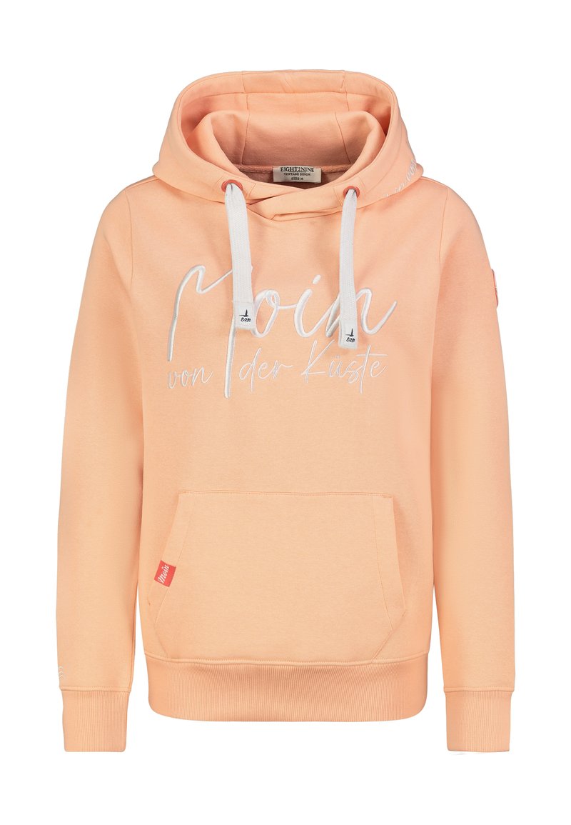 Perzikkleurige hoodie gemaakt van zacht stof, met een voorzak, witte trekkoorden en decoratieve tekst aan de voorkant.
