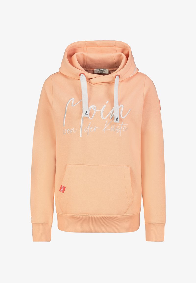 Perzikkleurige hoodie gemaakt van zacht stof, met een voorzak, witte trekkoorden en decoratieve tekst aan de voorkant.