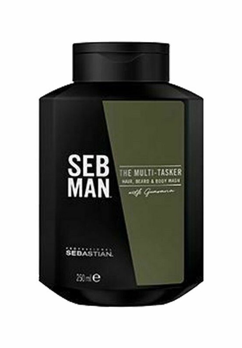 Zwarte vierkante plastic fles met een donkergroen label, met witte tekst die zegt "SEB MAN THE MULTI-TASKER HAIR, BEARD & BODY WASH." 250 ml.