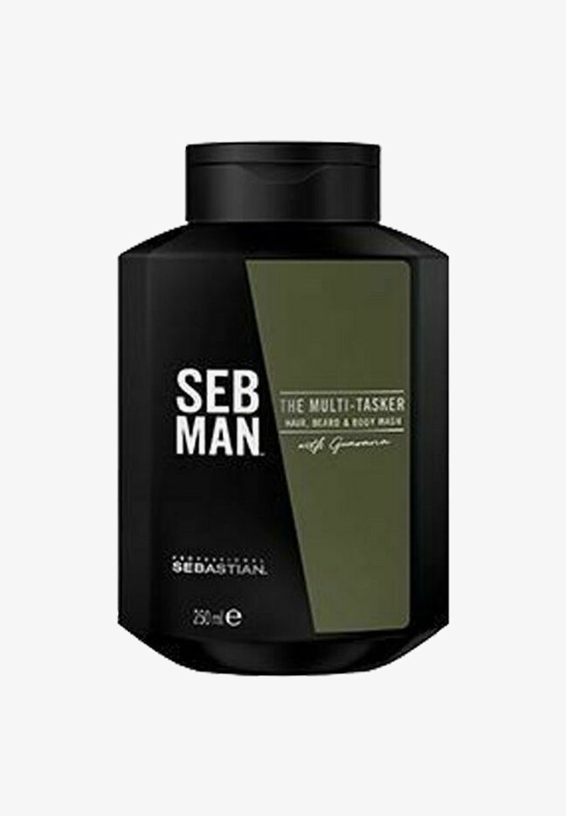 Zwarte vierkante plastic fles met een donkergroen label, met witte tekst die zegt "SEB MAN THE MULTI-TASKER HAIR, BEARD & BODY WASH." 250 ml.