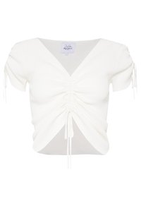 Bílý krátký rukáv top s výstřihem do V, s nařasením a tkaničkami po stranách, vyrobený z texturovaného žebrovaného materiálu.