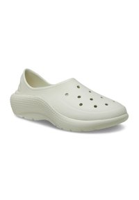 Light green clogs made of lightweight material, featuring ventilation holes, a rounded toe, textured sole, and a slip-on design.