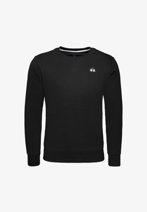 Sweatshirt noir en tissu texturé, avec un col rond, des manches longues et un petit logo blanc sur la poitrine.