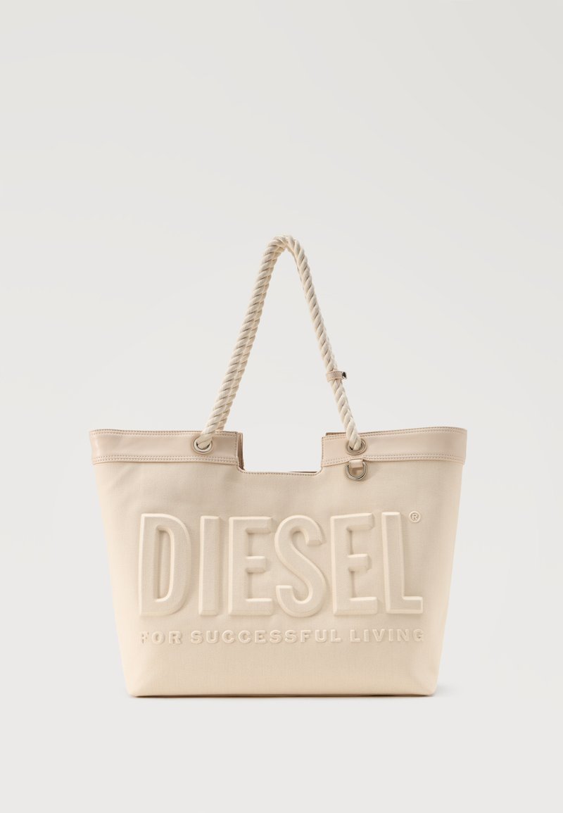 Μπεζ τσάντα tote από καμβά με λαβές από στριφτό σχοινί και ανάγλυφο λογότυπο "DIESEL For Successful Living" στο μπροστινό μέρος.