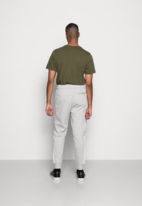 Nike Sportswear Calças de fato de treino - phantom