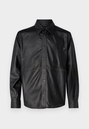 Black leather shirt jacket with a pointed collar, front button closure, long sleeves, and visible stitching details. Smooth texture.