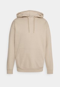 Beige huvtröja med en framficka, gjord av mjukt material. Har dragsko och ribbade ärmslut. Enkel, avslappnad design.