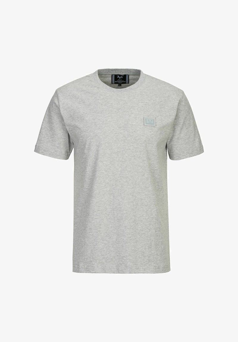 Graues T-Shirt mit kurzen Ärmeln aus Baumwolle, mit einem runden Ausschnitt und einem kleinen quadratischen Logo-Patch auf der linken Brustseite.