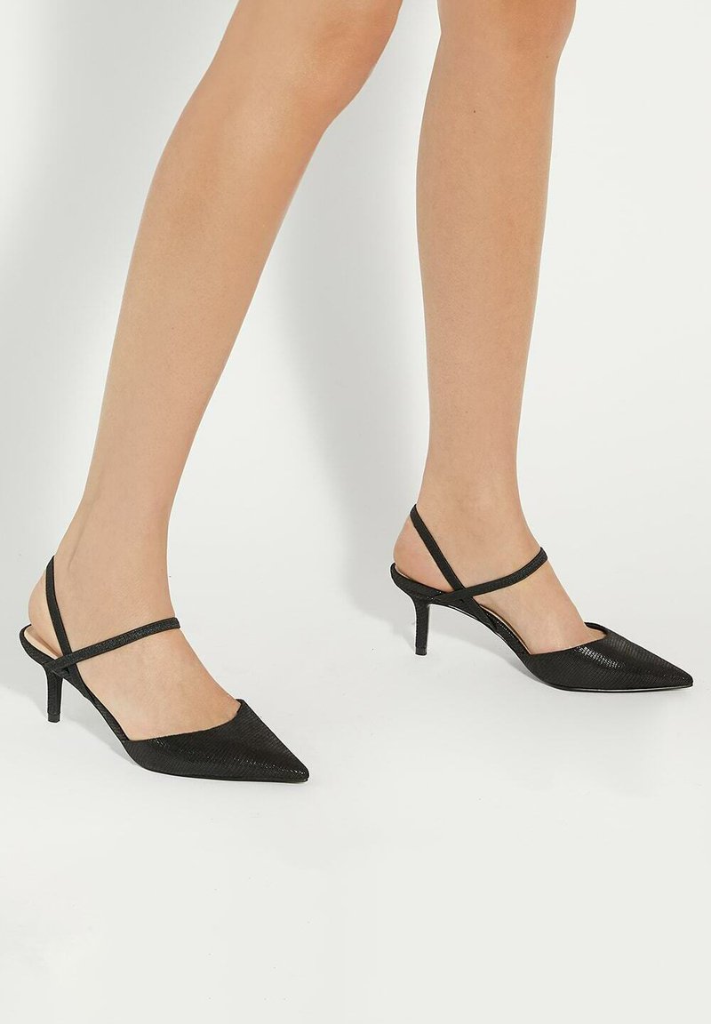 Black slingback heels with pointed toes, textured upper, and thin ankle straps, featuring a 5 cm stiletto heel.