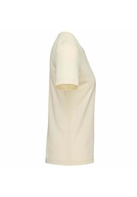 T-shirt a maniche corte, di colore crema, realizzato in morbido cotone. Vestibilità classica, scollatura rotonda, con orlo dritto e dettagli di cucitura minimali.