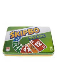 Metallic rectangular tin featuring "Skip-Bo Deluxe" in bold lettering. Green and white color scheme, displaying several multi-colored cards.
