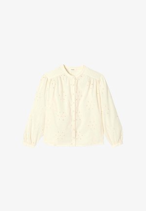 Blouse à manches longues couleur crème avec col rond, boutons sur le devant, épaules bouffantes, poignets élastiques et motif brodé à jour floral.