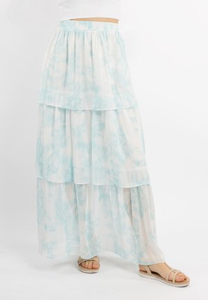 Gonna maxi a strati di colore azzurro chiaro realizzata in un tessuto delicato e fluente, caratterizzata da una texture plissettata e un sottile motivo tie-dye, completata da un morbido elastico in vita.