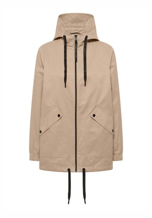Béžová bunda s kapucí, předním zipem, černými šňůrkami na kapuci a lemu a dvěma šikmými kapsami s klopou a černými patentkami.