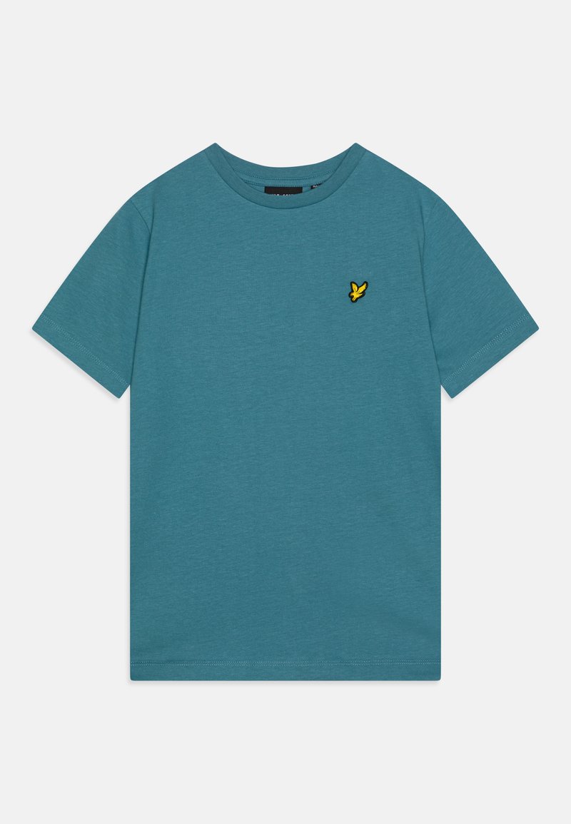 Camiseta de algodón azul con cuello redondo, mangas cortas y un logo de pájaro bordado en amarillo en el pecho izquierdo. Textura suave, ajuste casual.