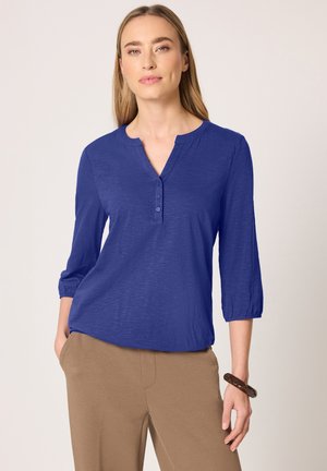 - Bluzka z długim rękawem