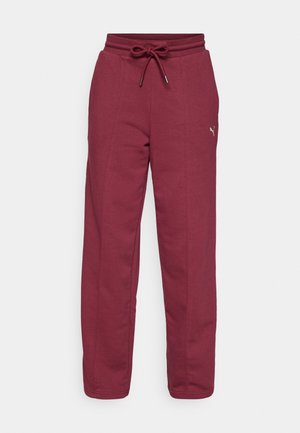Bordeaux joggebukser med elastisk midje, justerbar snor, sidesømmer, og en liten logo-detallering på venstre lår. Myk bomullsblanding.
