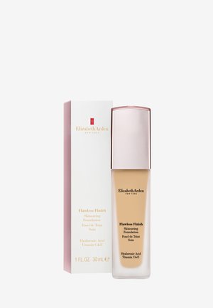 Flacon de fond de teint Elizabeth Arden Flawless Finish Skincare et boîte blanche avec texte doré, 1 once liquide, contient de l'acide hyaluronique et les vitamines C et E.