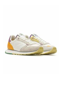 White sneakers with suede accents in beige, yellow, and purple. Features a textured sole and contrasting heel detail. Classic lace-up design.