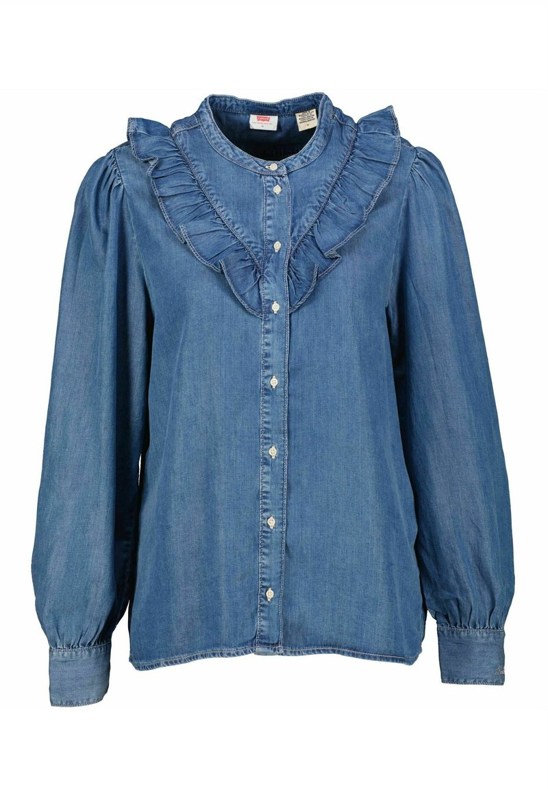 Blusa di denim con colletto arricciato e patta, maniche lunghe e volumetriche, chiusura frontale con bottoni e un morbido tessuto blu con una sottile texture.