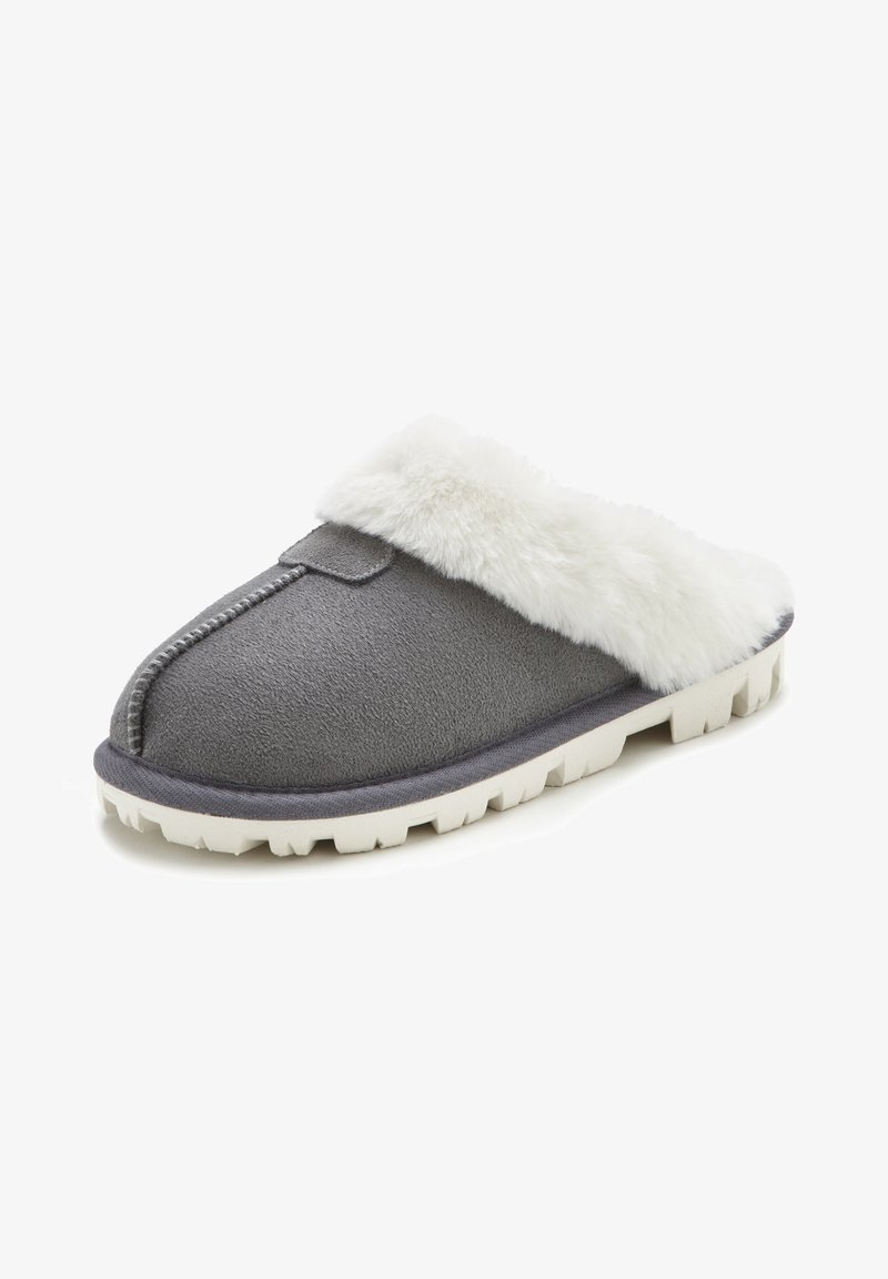 Gray suede slipper with a white faux fur cuff, featuring a rounded toe and a white rubber sole with a textured grip pattern.