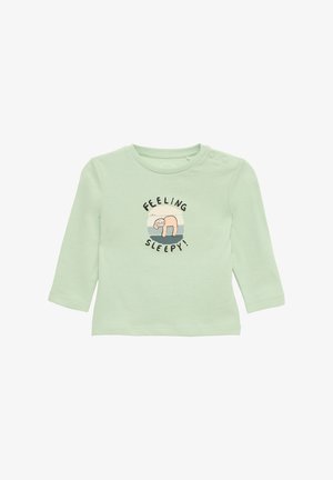 Long-sleeve mint green shirt in soft material featuring a playful graphic of a sloth with "FEELING SLEEPY!" text above. Two snap buttons at shoulder.