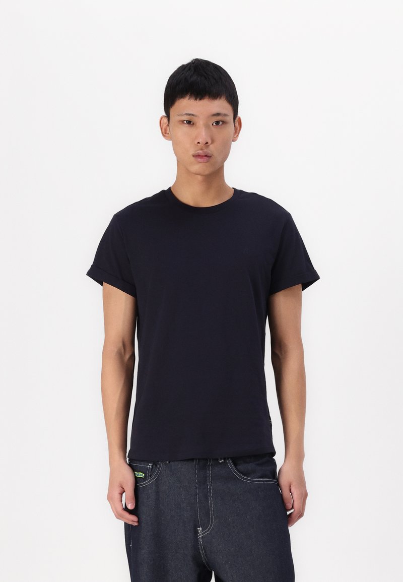 Navy blue cotton t-shirt with a crew neck and short sleeves. Features a subtle logo on the chest and a relaxed fit.