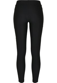 Leggings noirs à taille haute côtelés, ajustés, avec une coupe slim et une longueur ankle, montrés de dos sur un fond blanc.